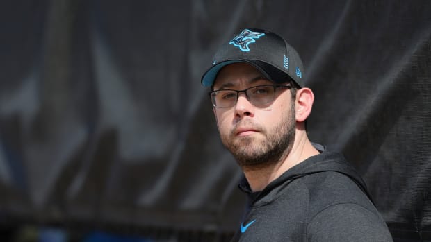Feb 17, 2024; Jupiter, FL, USA; Miami Marlins president of baseball operations Peter Bendix watches during a spring training workout at the Marlins Player Development & Scouting Complex. Mandatory Credit: Sam Navarro-USA TODAY Sports  